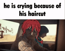 a man is crying because of his haircut with a picture of a person with red hair