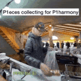 a man in a hat is standing in a kitchen with a sign that says ppieces collecting for p1harmony