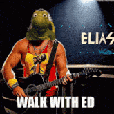 a man playing a guitar in front of a sign that says walk with ed