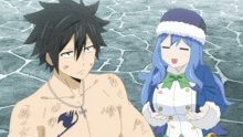 a man and a woman are standing next to each other and the man has a fairy tail tattoo on his chest