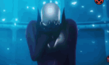 a cartoon character with a crown on his head is standing in front of a blue background .