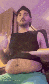 a man with a very large belly is holding a tray of food .