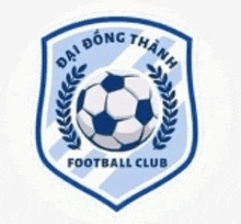 a blue and white shield with a soccer ball and laurel wreath .