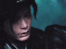 a close up of a person wearing a helmet with chinese writing on it