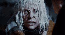 a close up of a woman with white hair