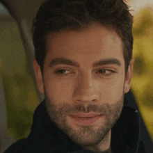 a close up of a man 's face with his eyes closed