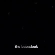 a close up of a woman 's face with the words `` the babadook '' written on the bottom .