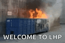 a blue dumpster is on fire and the words welcome to lhp are on the bottom