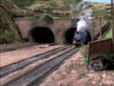 thomas the train is going through a tunnel and smoke is coming out of it