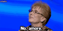 a woman wearing glasses says no amore
