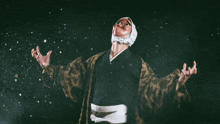 a person wearing a mask with chinese writing on the bottom