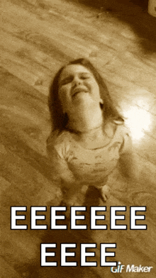 a little girl is laying on the floor with the words eeeeee eeee written on it