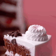 a slice of chocolate cake with whipped cream on top and the word mr. on the bottom