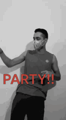 a man wearing a face mask is dancing with the word party in red