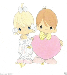 a boy and a girl holding a pink heart