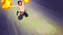 a man is jumping in the air while holding a fireball in his hands .