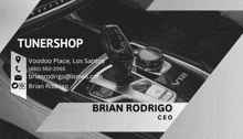 a business card for brian rodrigo shows a car interior