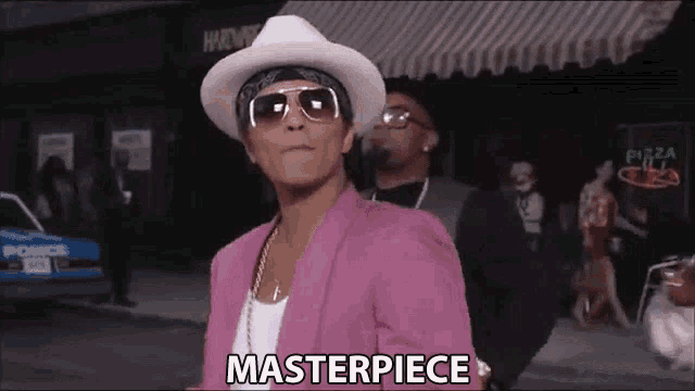 a man wearing a pink jacket and a white hat says masterpiece