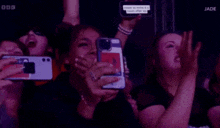 a group of people holding up their cell phones with one saying come to mine and a road after me