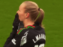 a woman wearing a black shirt that says visit amanda on it