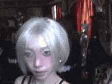 a gif of a woman 's face with the words aespagifs on the bottom right