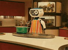 a robot cooking in a kitchen with the word kepler on the bottom right