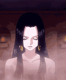 a woman with long black hair is standing in a dark room with her eyes closed