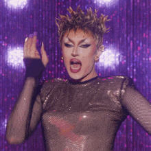 a woman with a mohawk pointing at something