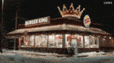 a burger king restaurant with a crown on top