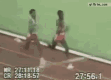 a person is running on a track with a time of 28 : 18 : 57