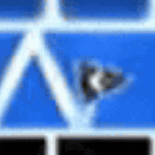 a blurred image of a blue background with a white triangle in the middle