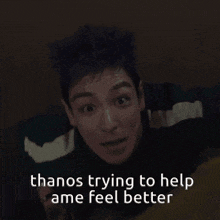 a man holding a cross with the caption thanos trying to help me feel better