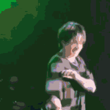 a woman in a green shirt with a pearl necklace is dancing