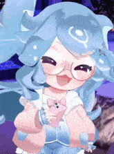 a girl with blue hair and glasses holds a pink phone