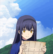 a girl with long dark hair is holding a piece of paper that says " i " on it