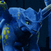 a blue dragon with green eyes and yellow spots on it 's body
