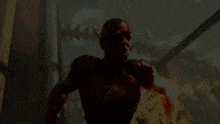 a man in a red superhero costume is running