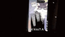 a phone screen shows a picture of a cat and says cat kiss