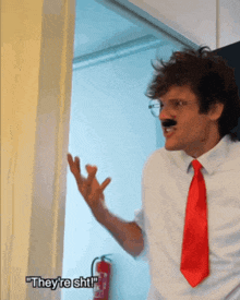 a man wearing a fake mustache and a red tie says they 're shit