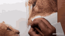 a drawing of a lion with the words made in animotica below it