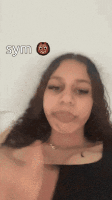a girl is making a funny face with the word sym written above her