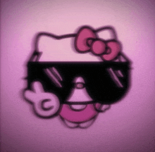 a hello kitty wearing sunglasses with a pink bow on her head