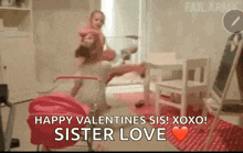 a little girl is holding a baby in her arms in a room with a valentine 's day message .
