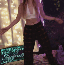 a woman is standing in front of a sign that says youth uncle