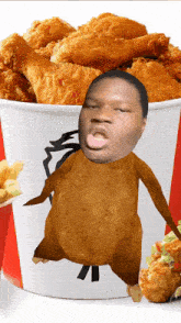 a bucket of fried chicken with a man 's face in it