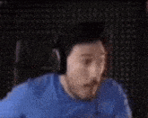 a man wearing headphones is sitting in a chair .
