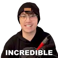 a man wearing glasses and a beanie has the word incredible on his sweatshirt