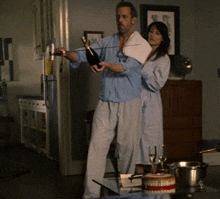 a man is pouring a bottle of champagne into a woman 's glass
