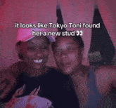 two women are kissing and the caption says it looks like tokyo toni found her a new stud