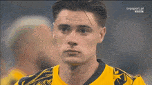 a close up of a man 's face with tvpsport.pl written on the bottom